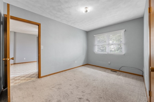 203 B Ave, Newhall, IA 52315 - spare room with baseboards and carpet