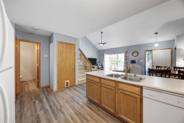 3810 Waterview Ct SW, Cedar Rapids, IA 52404 - kitchen with white appliances, light wood finished floors, light countertops, ceiling fan, and lofted ceiling