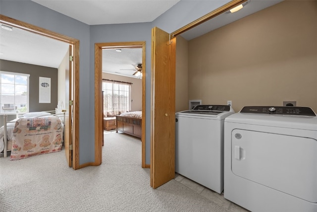 3810 Waterview Ct SW, Cedar Rapids, IA 52404 - washroom with washer and dryer, light carpet, and a ceiling fan