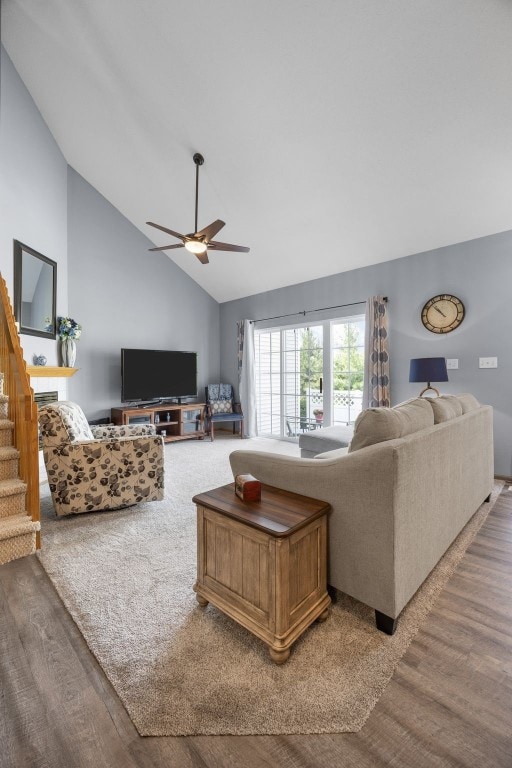 3810 Waterview Ct SW, Cedar Rapids, IA 52404 - living area featuring wood finished floors, vaulted ceiling, a ceiling fan, and stairway
