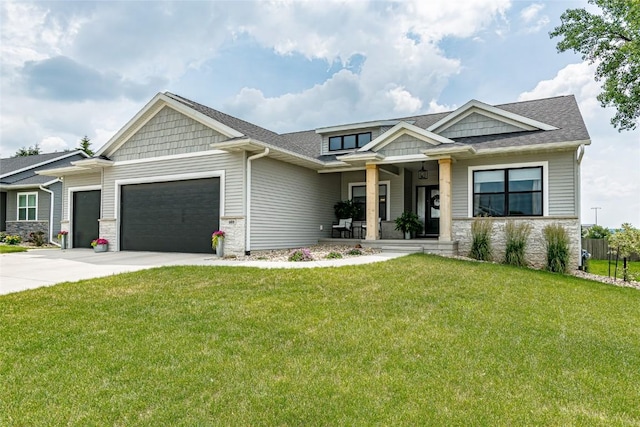 608 Pointer Cir, Center Point, IA 52213 - craftsman inspired home featuring stone siding, an attached garage, a porch, a front yard, and driveway