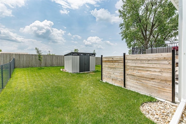 608 Pointer Cir, Center Point, IA 52213 - fenced backyard featuring a storage unit
