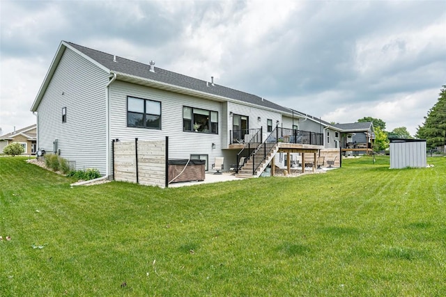 608 Pointer Cir, Center Point, IA 52213 - rear view of property featuring a deck, stairs, a shed, and a lawn
