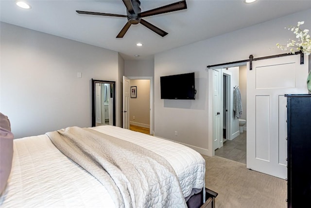 608 Pointer Cir, Center Point, IA 52213 - bedroom with recessed lighting, a barn door, light carpet, and ceiling fan