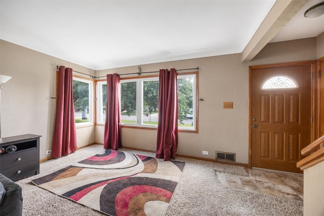 908 18th St SW, Cedar Rapids, IA 52404 - entrance foyer featuring carpet floors and healthy amount of natural light