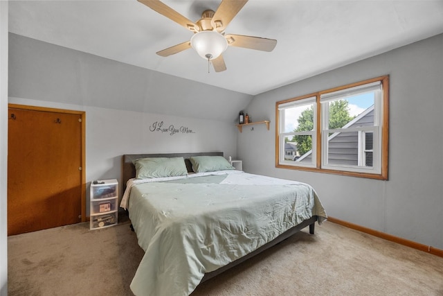 908 18th St SW, Cedar Rapids, IA 52404 - carpeted bedroom featuring vaulted ceiling and ceiling fan