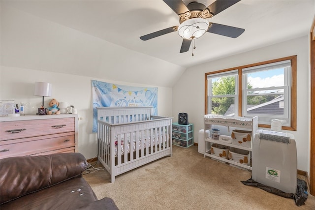908 18th St SW, Cedar Rapids, IA 52404 - bedroom featuring lofted ceiling, light carpet, a nursery area, a ceiling fan, and heating unit