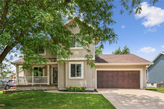 3210 5th St, Marion, IA 52302 - view of front facade with a porch, concrete driveway, a garage, and a front lawn
