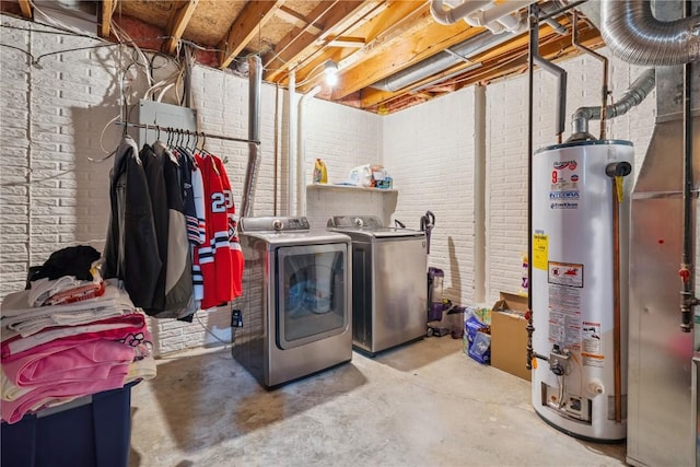 3210 5th St, Marion, IA 52302 - laundry room with water heater, washing machine and dryer, and brick wall