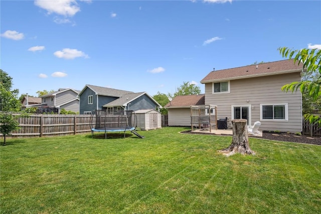 3210 5th St, Marion, IA 52302 - view of yard featuring a storage shed, a trampoline, and a patio area