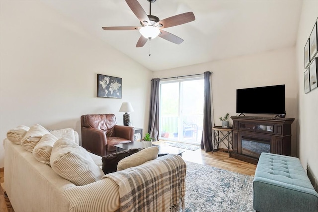 5752 Oakwood Ave NE Unit 3, Cedar Rapids, IA 52402 - living area featuring lofted ceiling, wood finished floors, and a ceiling fan