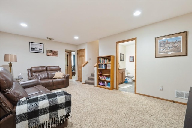 5752 Oakwood Ave NE Unit 3, Cedar Rapids, IA 52402 - living area featuring carpet floors, stairs, and recessed lighting