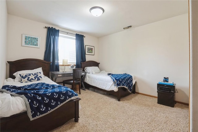 5752 Oakwood Ave NE Unit 3, Cedar Rapids, IA 52402 - carpeted bedroom with baseboards