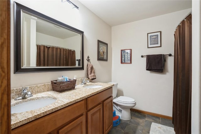 5752 Oakwood Ave NE Unit 3, Cedar Rapids, IA 52402 - full bathroom featuring double vanity and stone finish flooring