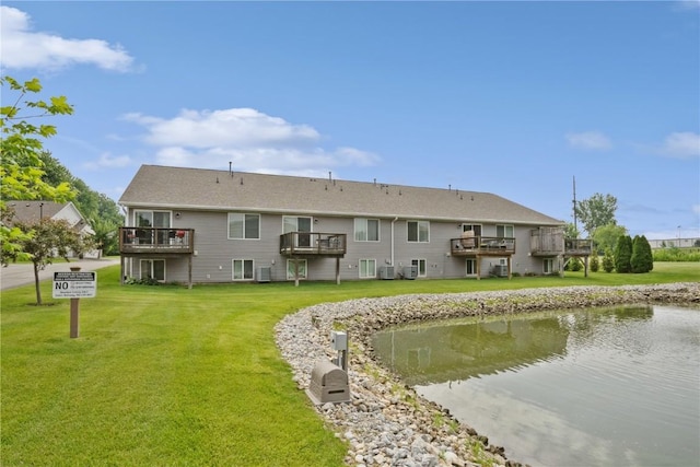 5752 Oakwood Ave NE Unit 3, Cedar Rapids, IA 52402 - rear view of house with a lawn and a deck