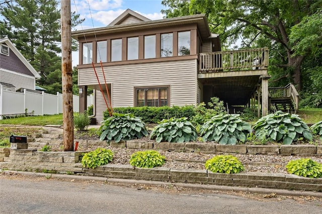 314 2nd St NW, Mount Vernon, IA 52314 - view of front of home featuring stairs and a wooden deck