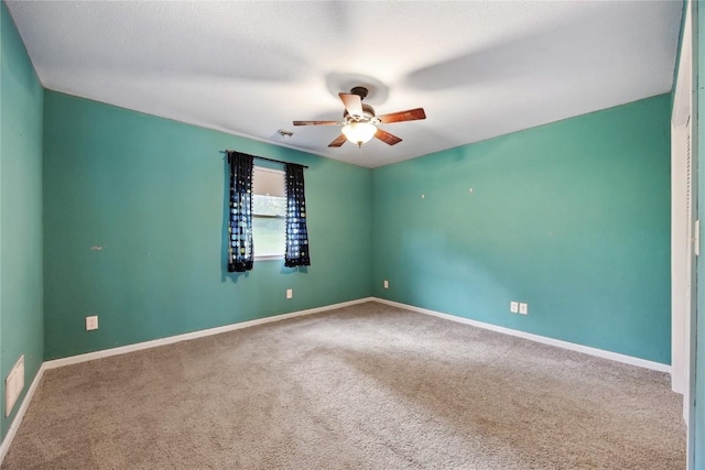 314 2nd St NW, Mount Vernon, IA 52314 - spare room with ceiling fan and carpet floors