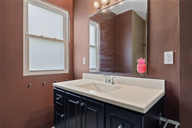 314 2nd St NW, Mount Vernon, IA 52314 - bathroom featuring vanity and a textured wall