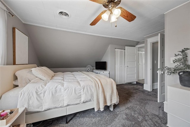 1307 8th St NW, Cedar Rapids, IA 52405 - bedroom with lofted ceiling, dark carpet, and a ceiling fan