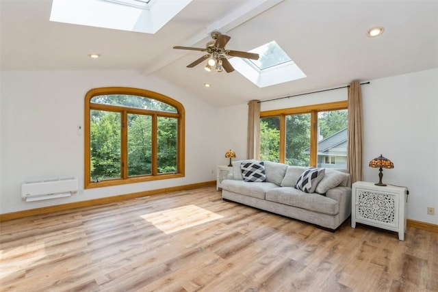 1916 Oak Knoll Ct SE, Cedar Rapids, IA 52403 - living room with a skylight, wood finished floors, a ceiling fan, and recessed lighting