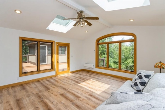 1916 Oak Knoll Ct SE, Cedar Rapids, IA 52403 - living area with a skylight, wood finished floors, a ceiling fan, an AC wall unit, and recessed lighting