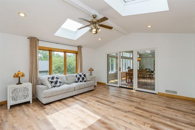 1916 Oak Knoll Ct SE, Cedar Rapids, IA 52403 - living room with a skylight, light wood finished floors, ceiling fan, and recessed lighting