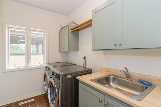 1916 Oak Knoll Ct SE, Cedar Rapids, IA 52403 - laundry area with cabinet space and washer and clothes dryer