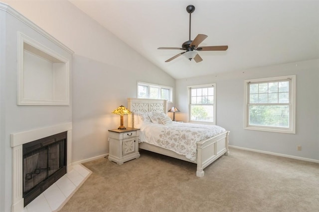 1916 Oak Knoll Ct SE, Cedar Rapids, IA 52403 - bedroom with a fireplace with flush hearth, lofted ceiling, light carpet, and a ceiling fan