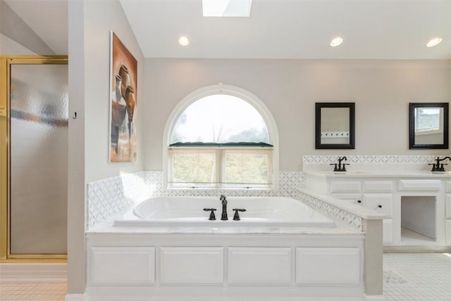 1916 Oak Knoll Ct SE, Cedar Rapids, IA 52403 - full bathroom with a shower stall, a garden tub, tile patterned floors, a skylight, and recessed lighting