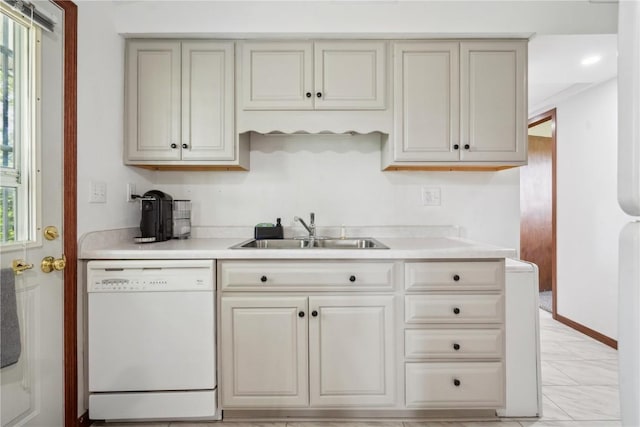 5995 32nd Ave, Shellsburg, IA 52332 - kitchen with white dishwasher, light countertops, and cream cabinetry