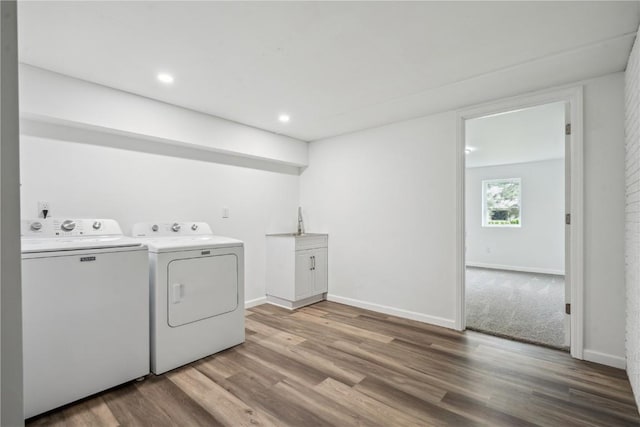 5995 32nd Ave, Shellsburg, IA 52332 - laundry area featuring washing machine and clothes dryer, wood finished floors, recessed lighting, and cabinet space