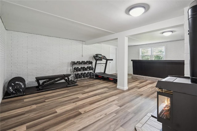 5995 32nd Ave, Shellsburg, IA 52332 - exercise room with wood finished floors and brick wall