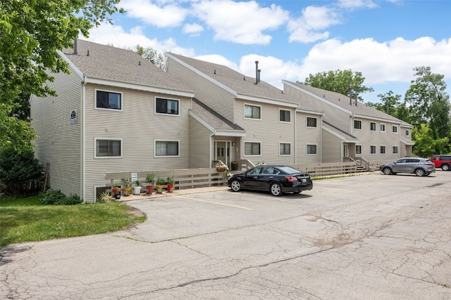 215 40th St Dr SE Unit 301, Cedar Rapids, IA 52403 - view of building exterior featuring uncovered parking