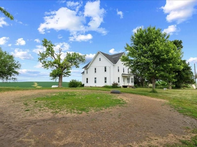 1931 140th St, Lowden, IA 52255 - view of home's exterior featuring a yard