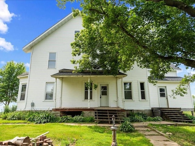 1931 140th St, Lowden, IA 52255 - rear view of property featuring a yard and covered porch