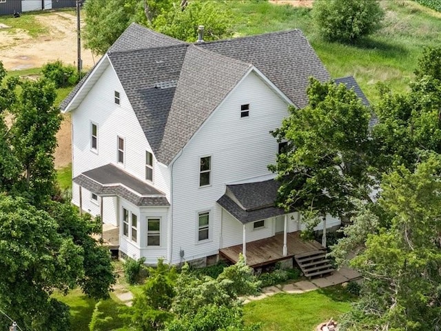 1931 140th St, Lowden, IA 52255 - rear view of property with a shingled roof and a wooden deck