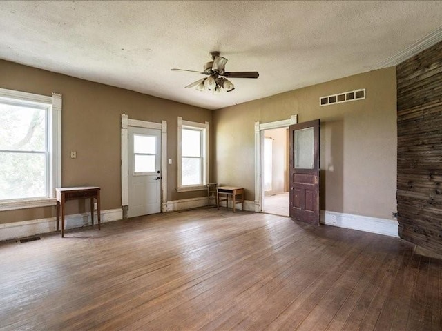 1931 140th St, Lowden, IA 52255 - entrance foyer with hardwood / wood-style flooring, a ceiling fan, and a textured ceiling