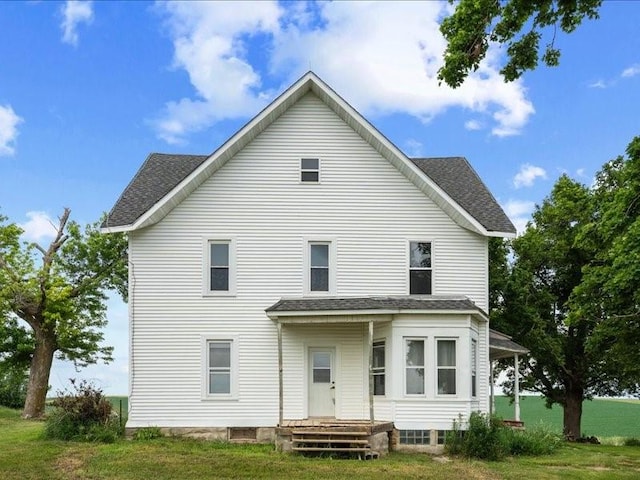 1931 140th St, Lowden, IA 52255 - back of property featuring a shingled roof and a yard