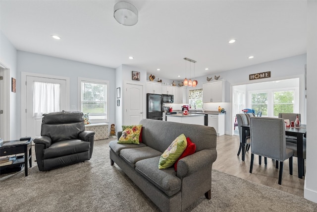 1062 Oak View Ct, Tipton, IA 52772 - living room featuring recessed lighting and light wood-style floors