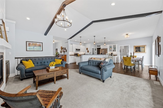 1062 Oak View Ct, Tipton, IA 52772 - living room featuring a chandelier, carpet, recessed lighting, a fireplace, and wood finished floors