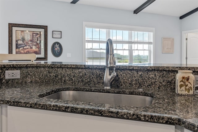 1062 Oak View Ct, Tipton, IA 52772 - kitchen view of a sink and dark stone countertops
