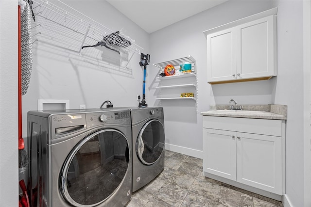 1062 Oak View Ct, Tipton, IA 52772 - laundry area featuring washer and clothes dryer and cabinet space