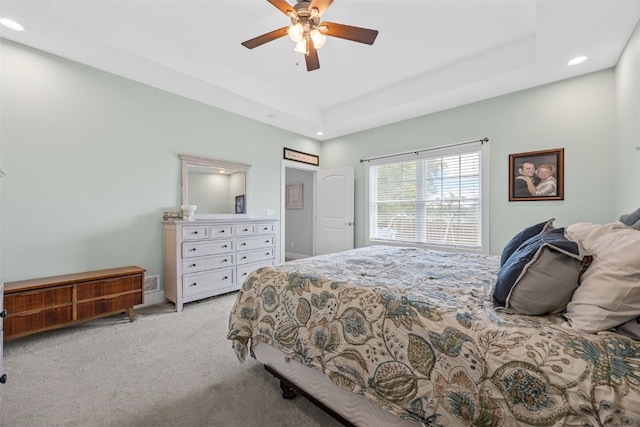 1062 Oak View Ct, Tipton, IA 52772 - bedroom with recessed lighting, light colored carpet, a raised ceiling, and a ceiling fan
