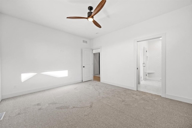 2682 Burr Oak Ct, Marion, IA 52302 - unfurnished bedroom featuring carpet floors, connected bathroom, and a ceiling fan