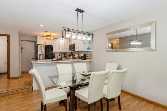 1932 N Ridge Dr, Coralville, IA 52241 - dining room with light wood finished floors and recessed lighting