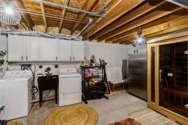 1932 N Ridge Dr, Coralville, IA 52241 - laundry area featuring cabinet space and washer and clothes dryer