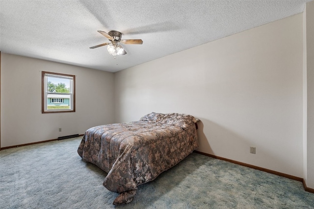 105 Parkview Dr, Tipton, IA 52772 - bedroom featuring carpet flooring, a ceiling fan, and a textured ceiling