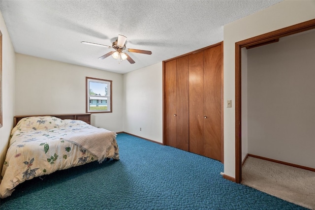 105 Parkview Dr, Tipton, IA 52772 - carpeted bedroom with a closet, ceiling fan, and a textured ceiling