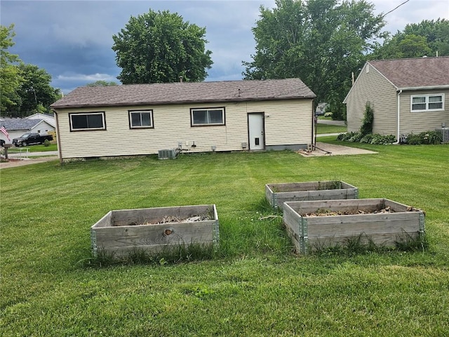1523 Golden Valley Dr, Bettendorf, IA 52722 - rear view of property featuring a vegetable garden and a yard