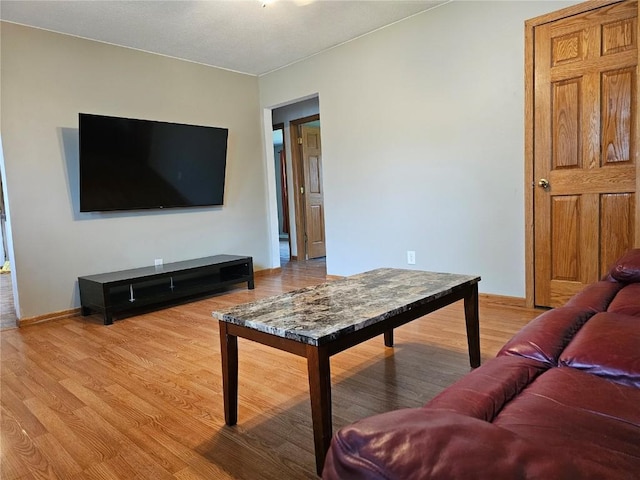 1523 Golden Valley Dr, Bettendorf, IA 52722 - living room featuring light wood finished floors and baseboards